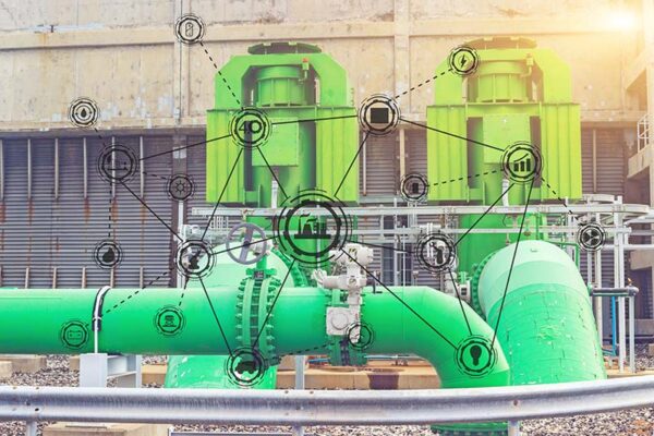 A complex industrial system with large green pipes and interconnected technology icons.