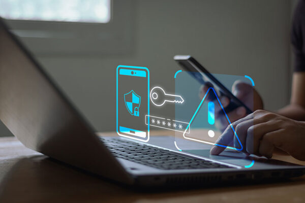 Digital cybersecurity icons representing 4G security overlay a person using a smartphone and laptop.
