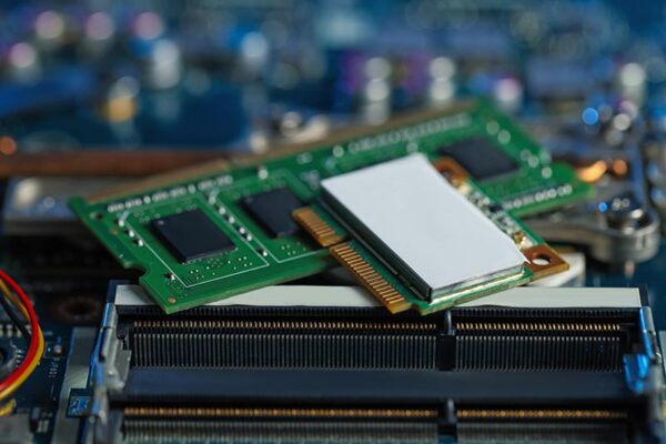 A small form factor mPCIe sits atop a motherboard and other computer components.