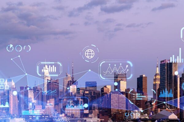 City skyline at dusk with digital data icons and graphs superimposed, representing technology and data integration in urban environments.