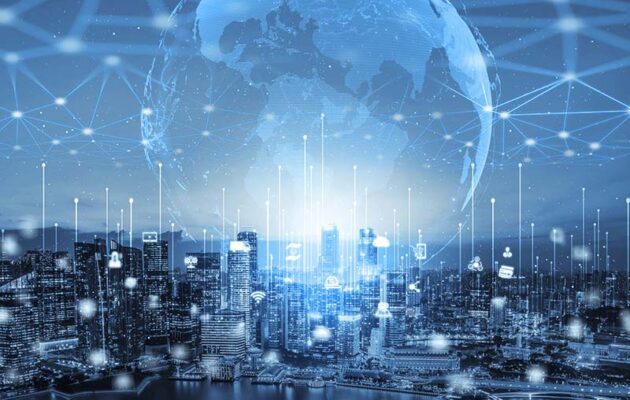 A city skyline at night overlaid by a large glowing globe connected by various lines and nodes, symbolizing global digital connectivity.