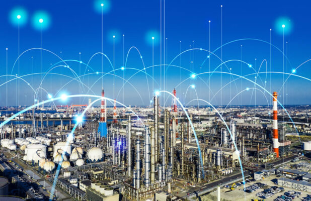 An industrial complex under a clear blue sky, depicted with digital lines and points suggesting technological integration through private 5G networks.