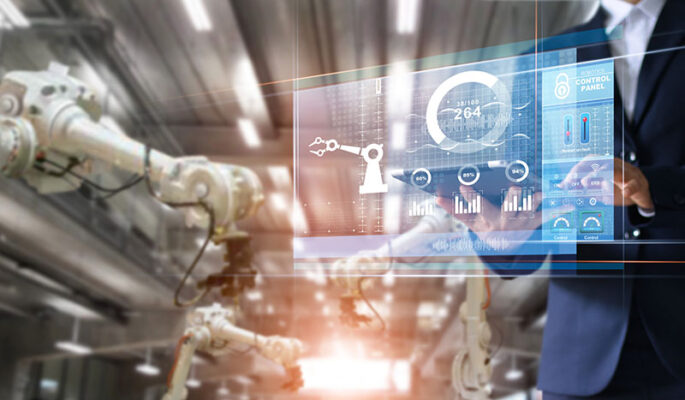 In a modern factory setting, a person engages with a digital control panel for complete device management of robotic arms and industrial machinery.