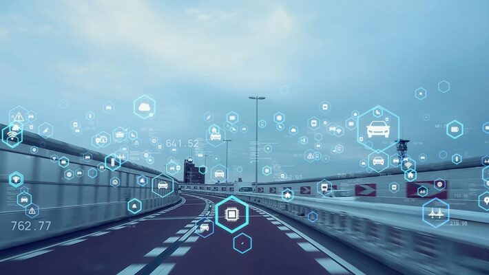 A smart highway overlaid with icons for data connectivity, autonomous driving technology and video telematics cameras.