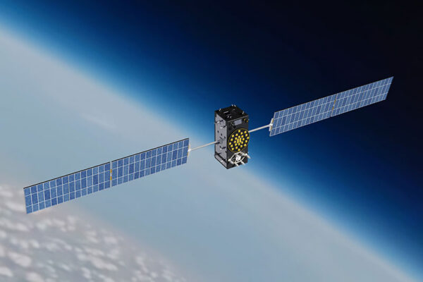 A GNSS satellite with large solar panels orbits above Earth. The planet’s curved horizon and atmosphere are visible in the background.