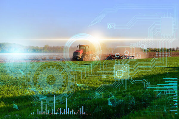 A red tractor in a field is overlaid with digital circuit and gear graphics, representing smart farming technology.