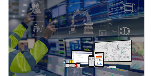 A person in a high-visibility jacket interacts with Promatic digital control screens displaying industrial data, diagrams, and automation interfaces in a control room.