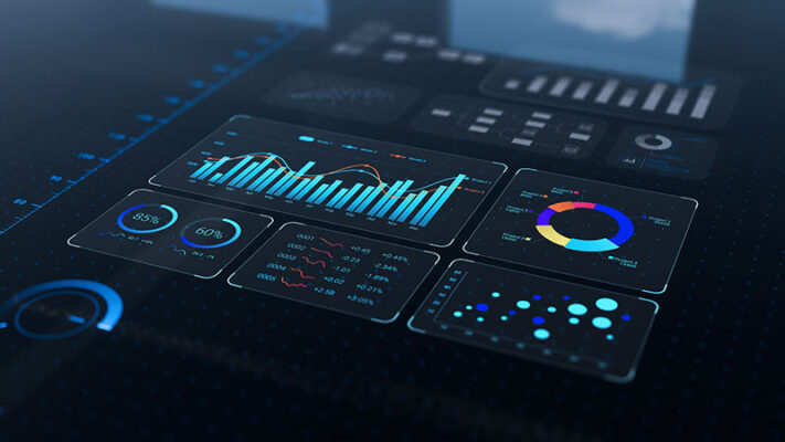 A digital dashboard displays charts and graphs with data analytics on a dark background, showing real-time IIoT data management.