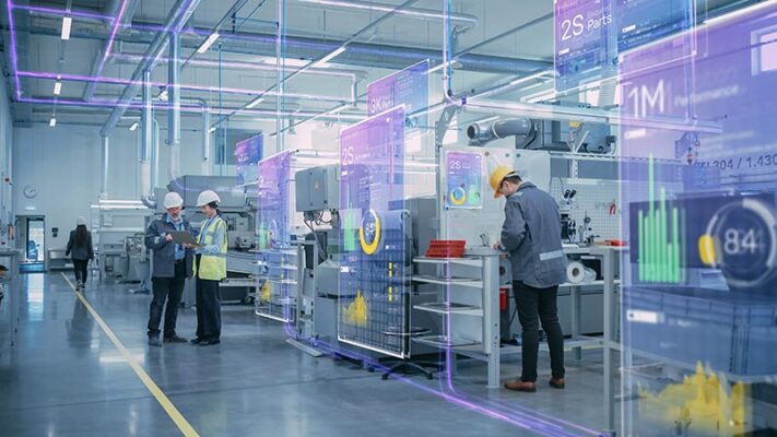 A high-tech factory with workers wearing hard hats. Augmented reality displays real-time data, statistics and overlays about machinery and production inside an industrial setting.