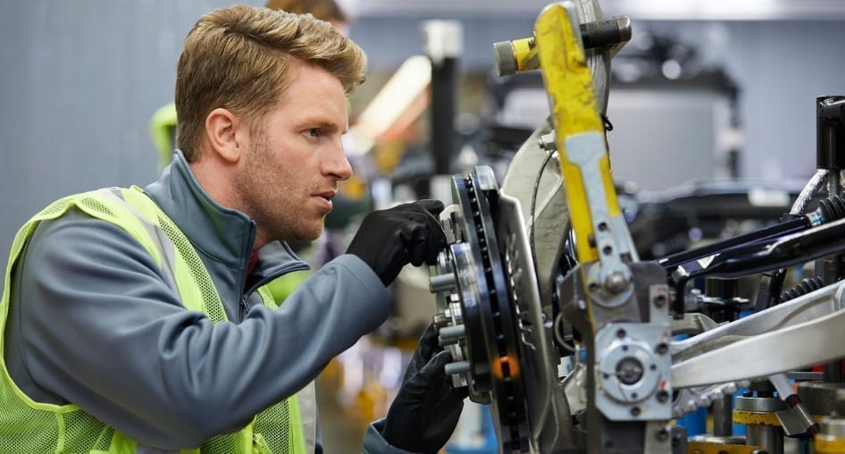 Person working in an automotive factory.