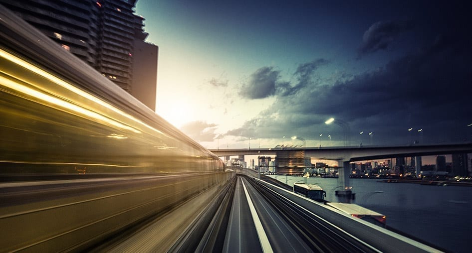 The blur of a train speeding by. The right IoT partner can help you transform your business and get to your destination faster with fewer stops.