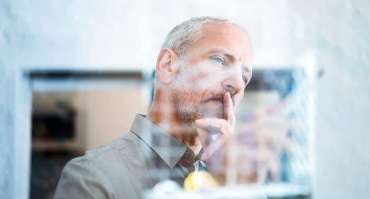 Person looking at data and deep in thought.