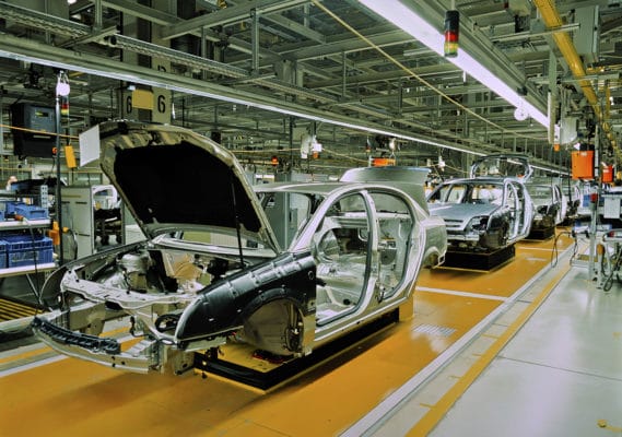 An assembly line of cars in an OPC factory.