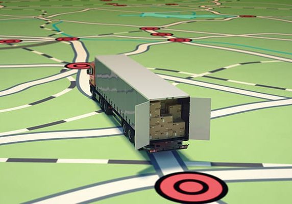 A truck equipped with IoT asset tracking technology driving on a map.
