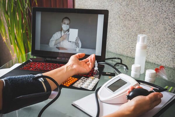 A doctor conducts a remote consultation.