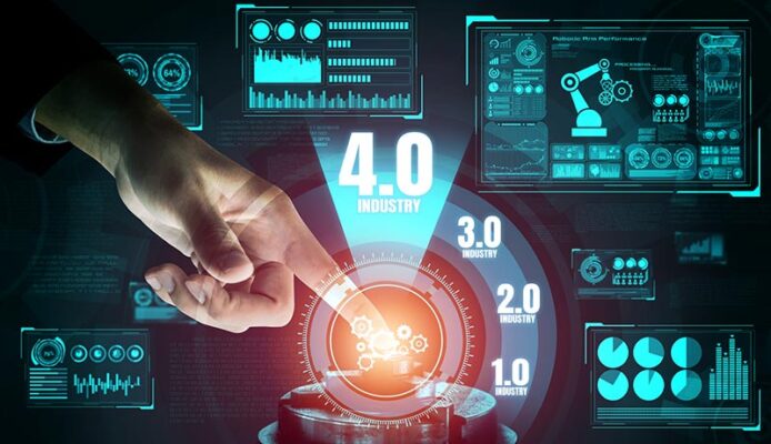 An Industry 4.0 concept with hovering graphics showing data from automated systems and machinery.