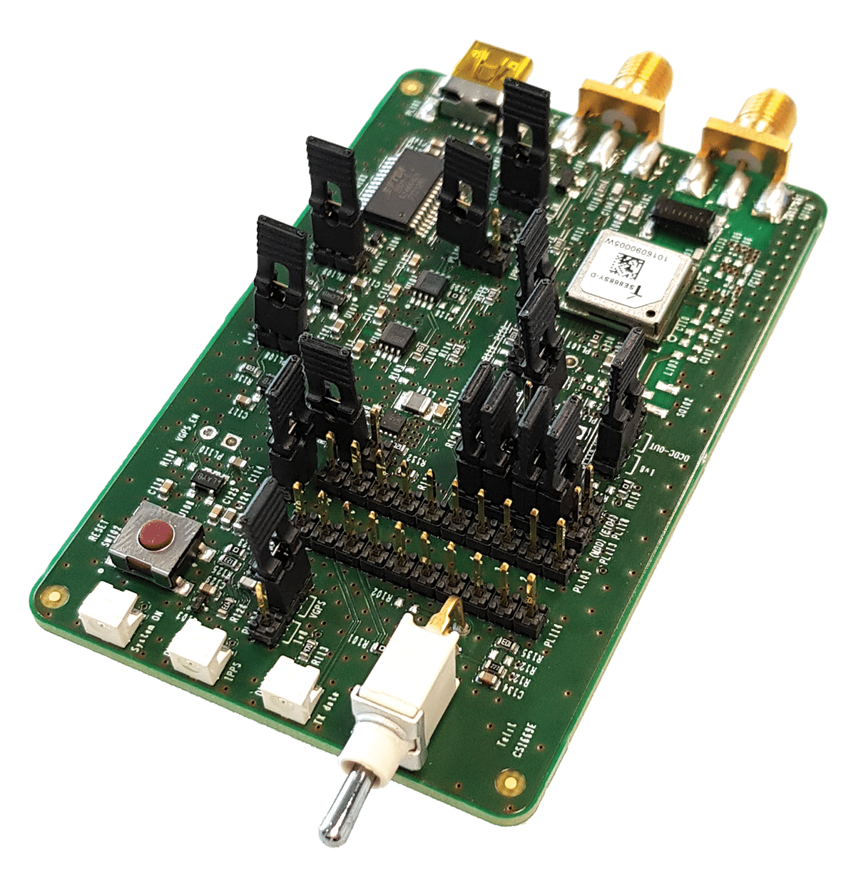 A microcontroller board with a number of electronic components for development.