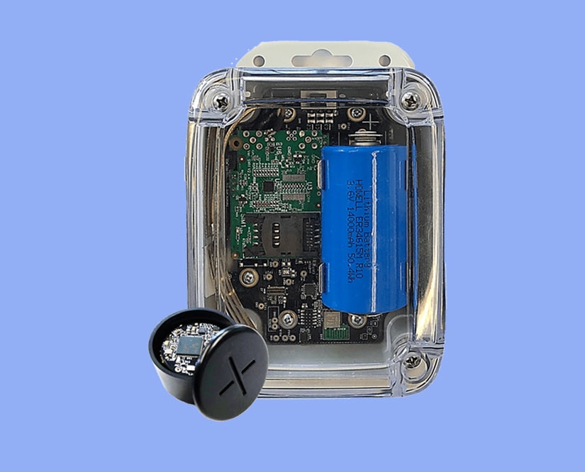 A small electronic device with a button and a OneEdge battery.