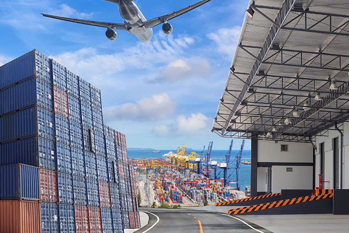 A plane is flying over a warehouse, showcasing the efficient supply chain management in action.