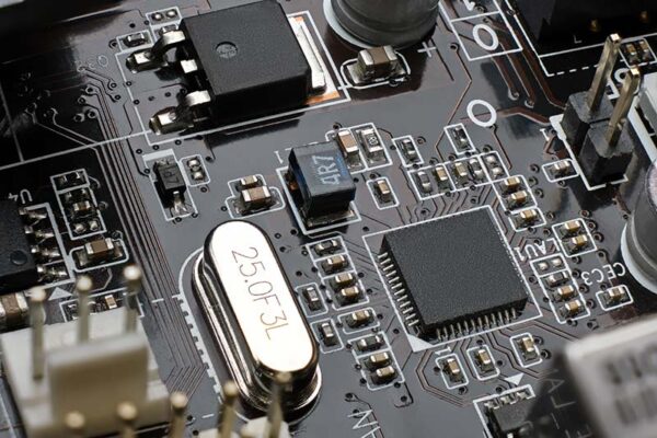 Circuit board with various components, including resistors, capacitors, microchips and a GNSS module.