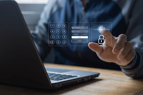A person interacts with a virtual login interface on a laptop, selecting fingerprint authentication.