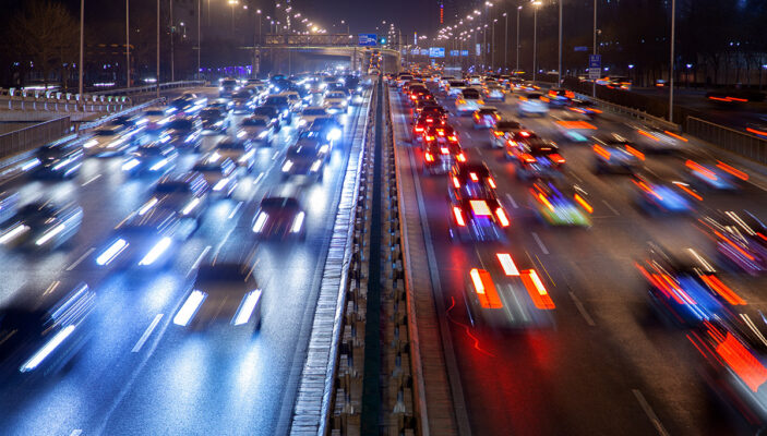 Motion blur of vehicles driving on a highway.