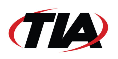 A logo with the word "at" from TIA.