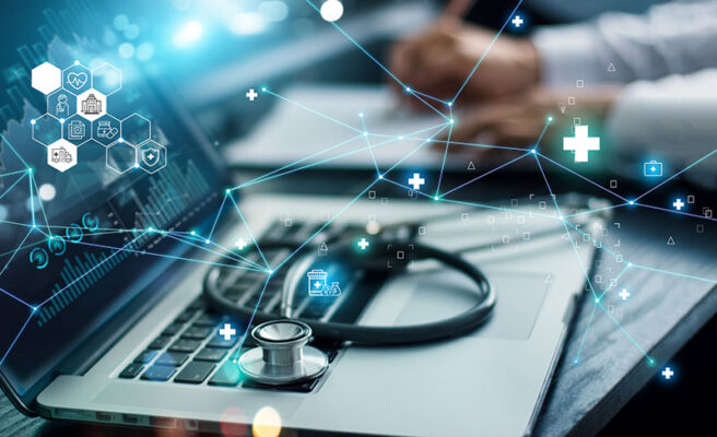 A stethoscope rests on a laptop surrounded by digital health icons and network lines, symbolizing the harmony of 5G and IoT technology. A person writes in the background, capturing the essence of modern health care connectivity.