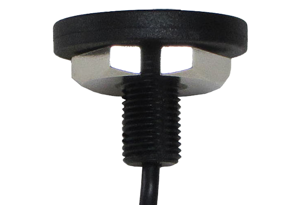 Close-up of a black threaded sensor or electronic component with a cable attached, featuring a hexagonal nut for mounting.