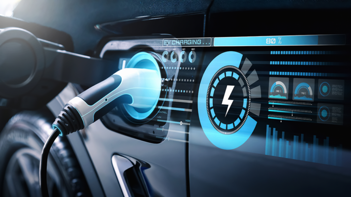 An electric car is undergoing EV charging with a charger.