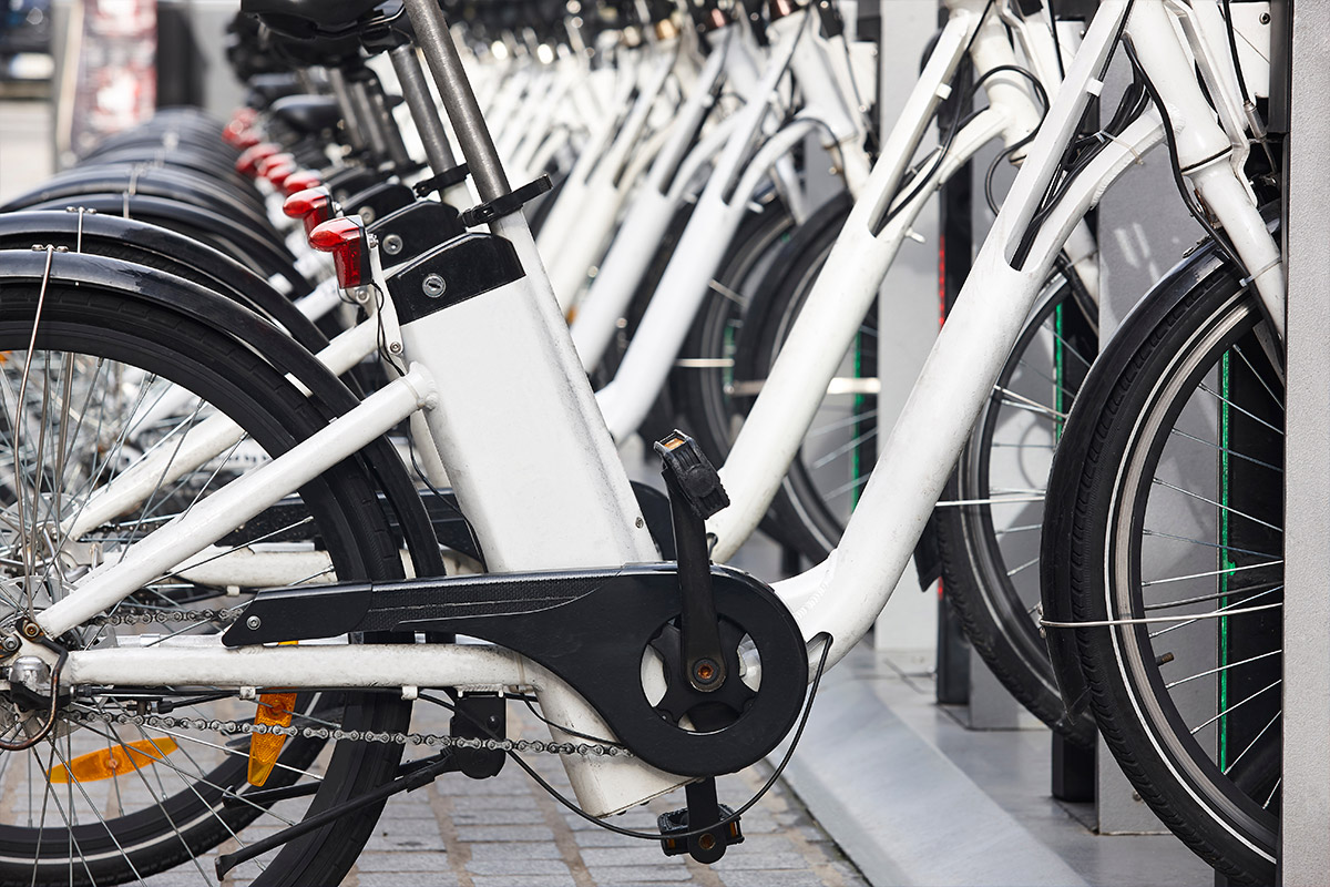 A row of bicycles parked next to each other, showcasing the convenience of micromobility.