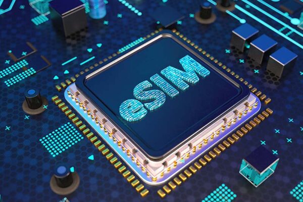 Computer chip with the word "eSIM" illuminated on its surface, placed on a circuit board with blue and gold components, signifying the eUICC standard.
