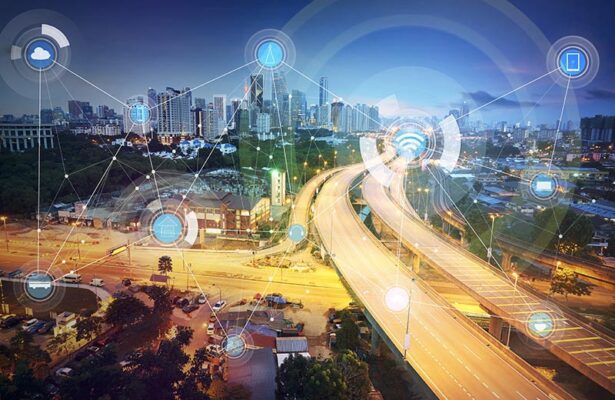 A digital network icons overlay a highway running through a city with tall buildings.