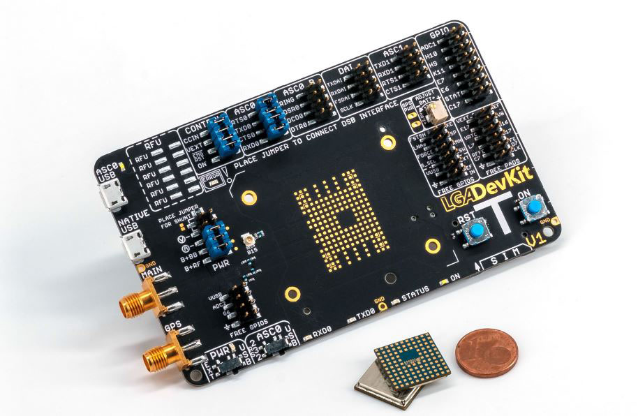 A small board with a chip from the Cinterion® LGA DevKit Family and a coin next to it.