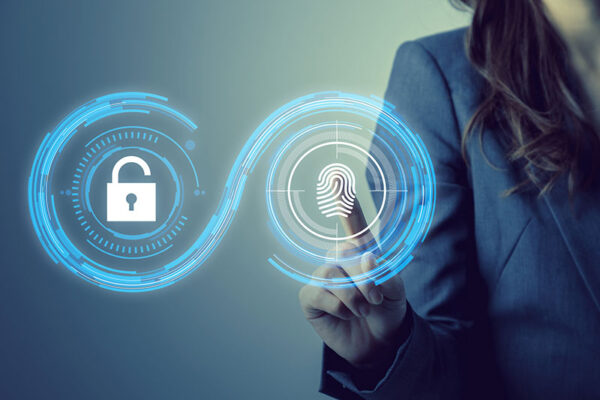A person in business attire touches a digital interface displaying a fingerprint and padlock icon.
