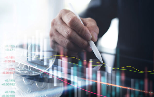 A person holding a stylus and analyzing financial data on a tablet.