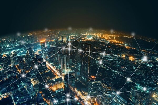 A city is enveloped in a secure wireless network, enabling reliable IoT connectivity.