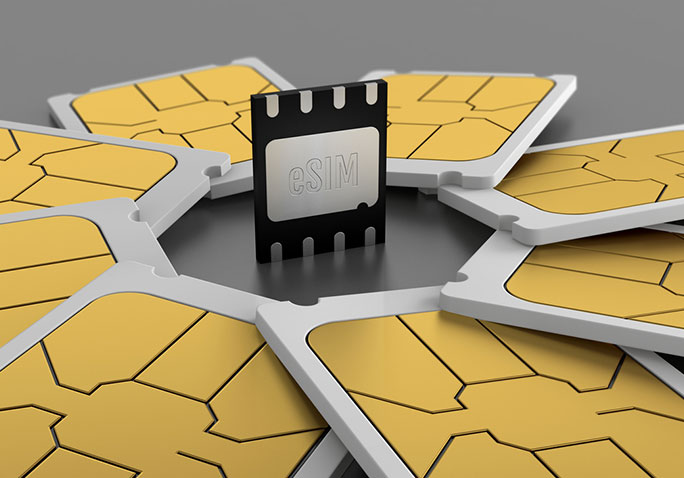 An eSIM surrounded by SIM cards.