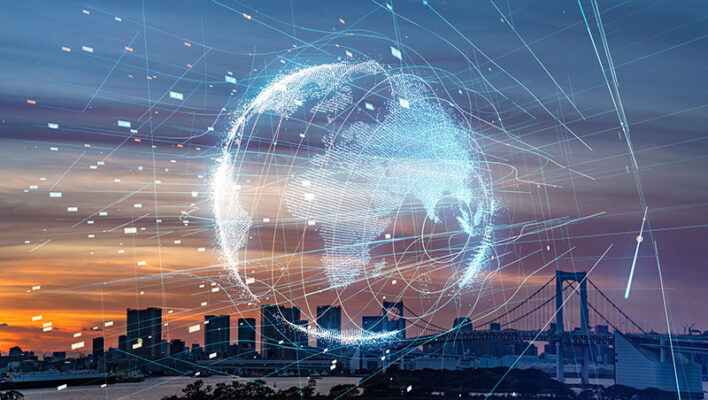 A digital representation of Earth and connectivity lines overlaid on a cityscape at sunset.