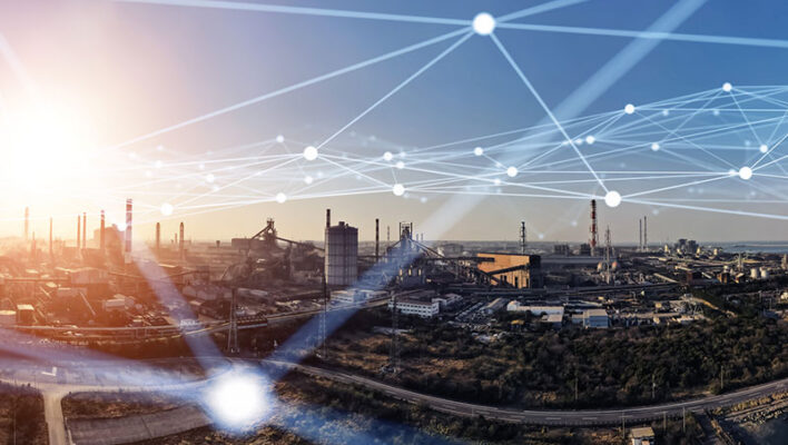 An industrial site with multiple factories and smokestacks under a network of glowing, interconnected lines.