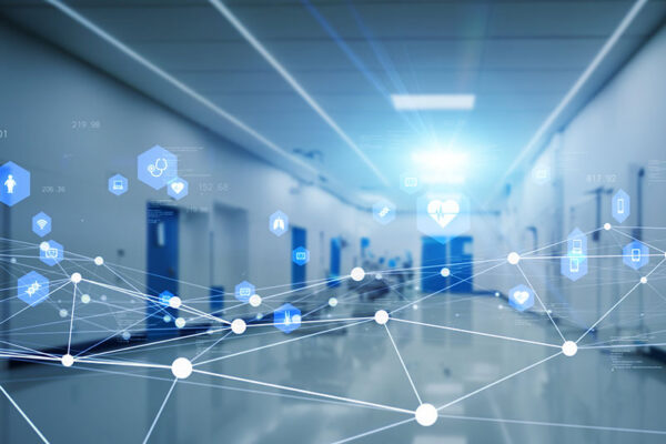 A hospital corridor with digital health icons and network lines overlaid, suggesting private 5G in health care.