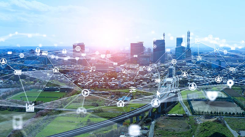 A cityscape with network graphics.