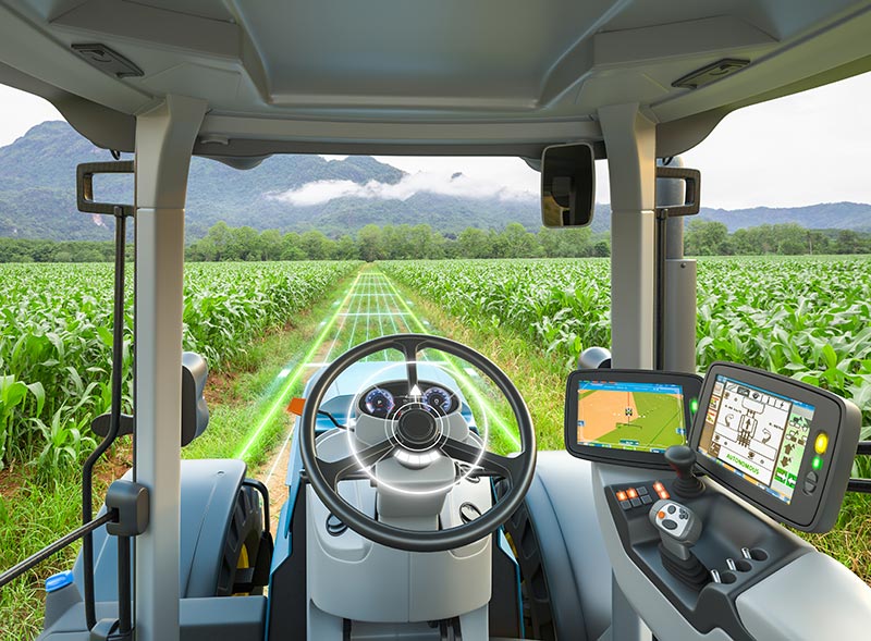 View from inside a modern tractor cab showing digital navigation systems, seamlessly integrated with IoT supply chain technologies.