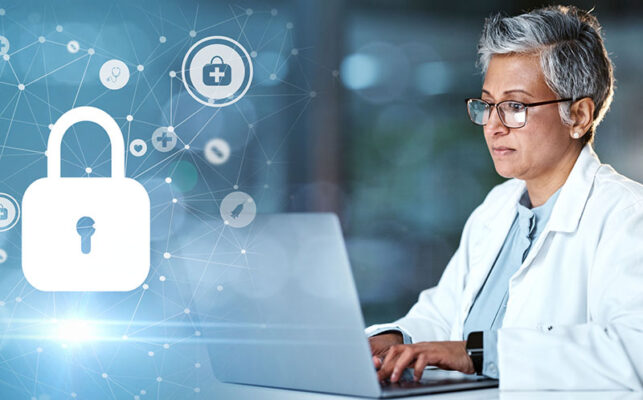 A person in a lab coat uses a laptop. A large lock icon signifies cybersecurity or data protection, accompanied by various medical icons that hint at RTM device reimbursement's role in health care technology.