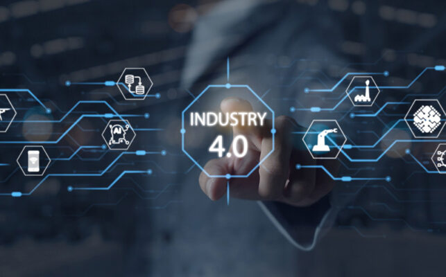 A person interacts with a digital interface displaying "Industry 4.0," showing the seamless integration of IIoT systems management.