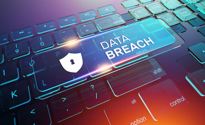 A computer keyboard showcases a highlighted key with a shield icon and the words "Data Breach" in bold.
