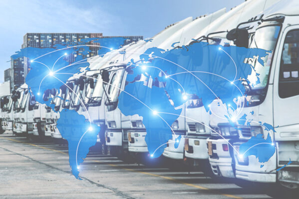 Rows of white trucks with a superimposed world map and connected lines, symbolizing global transportation or logistics, navigate with dead reckoning to ensure seamless delivery across continents.