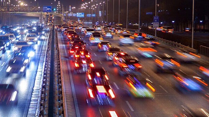 Motion blur of vehicles driving on a highway.