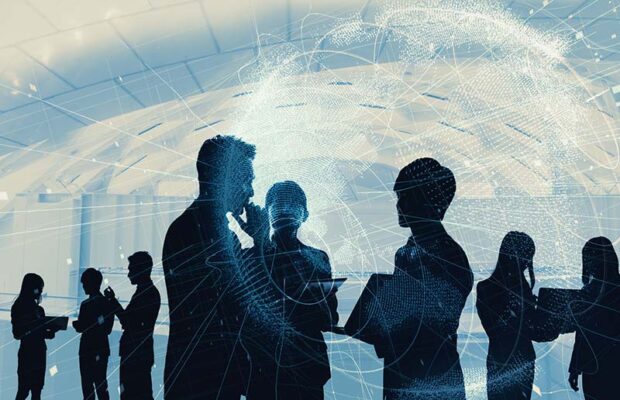 Silhouettes of people in a group discussion, set against a digital, network-like backdrop in a modern office environment.