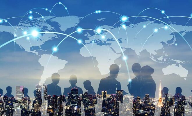 Silhouettes of people against a cityscape, with a world map overlay. Blue arcs connect various points on the map, symbolizing global communication.
